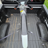Truck bed tie down system