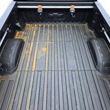 Truck bed tie down system
